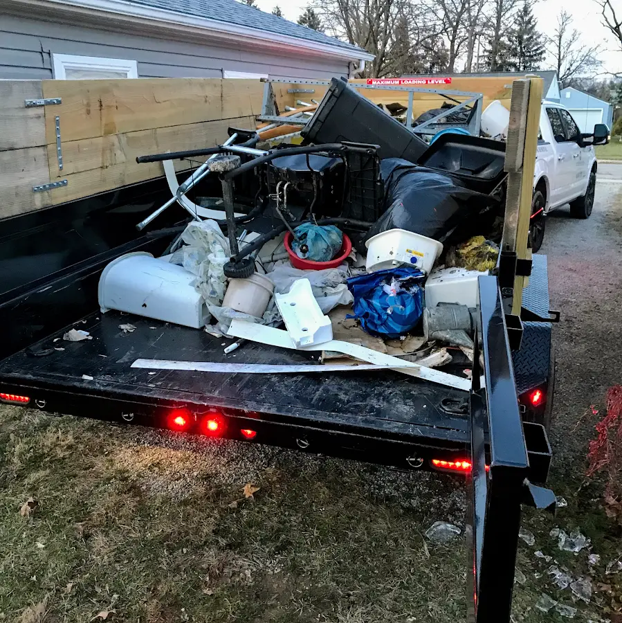 Roll-off dumpster delivered to a residential driveway in Tanaina