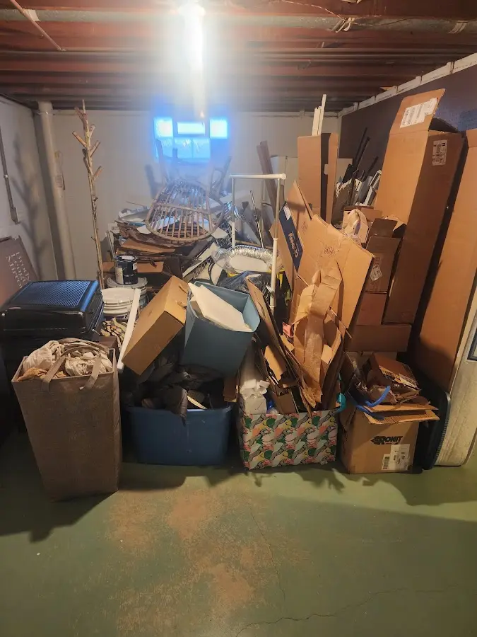 Roll-off dumpster container at job site for 6 Yard Dumpster Rental in Tanaina