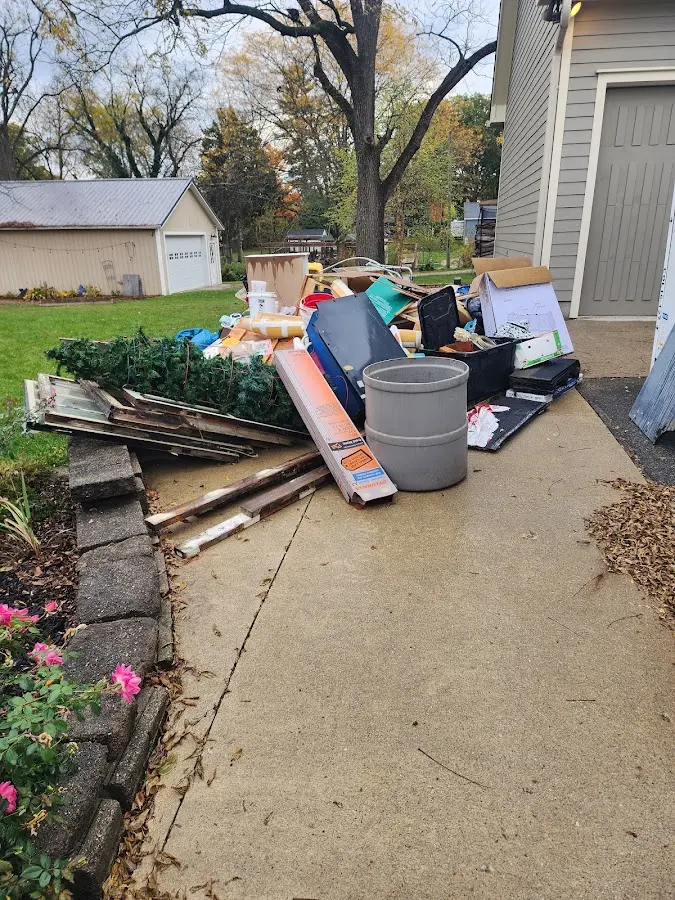 Dumpster being loaded with debris for 30 Yard Dumpster Rental in Tanaina